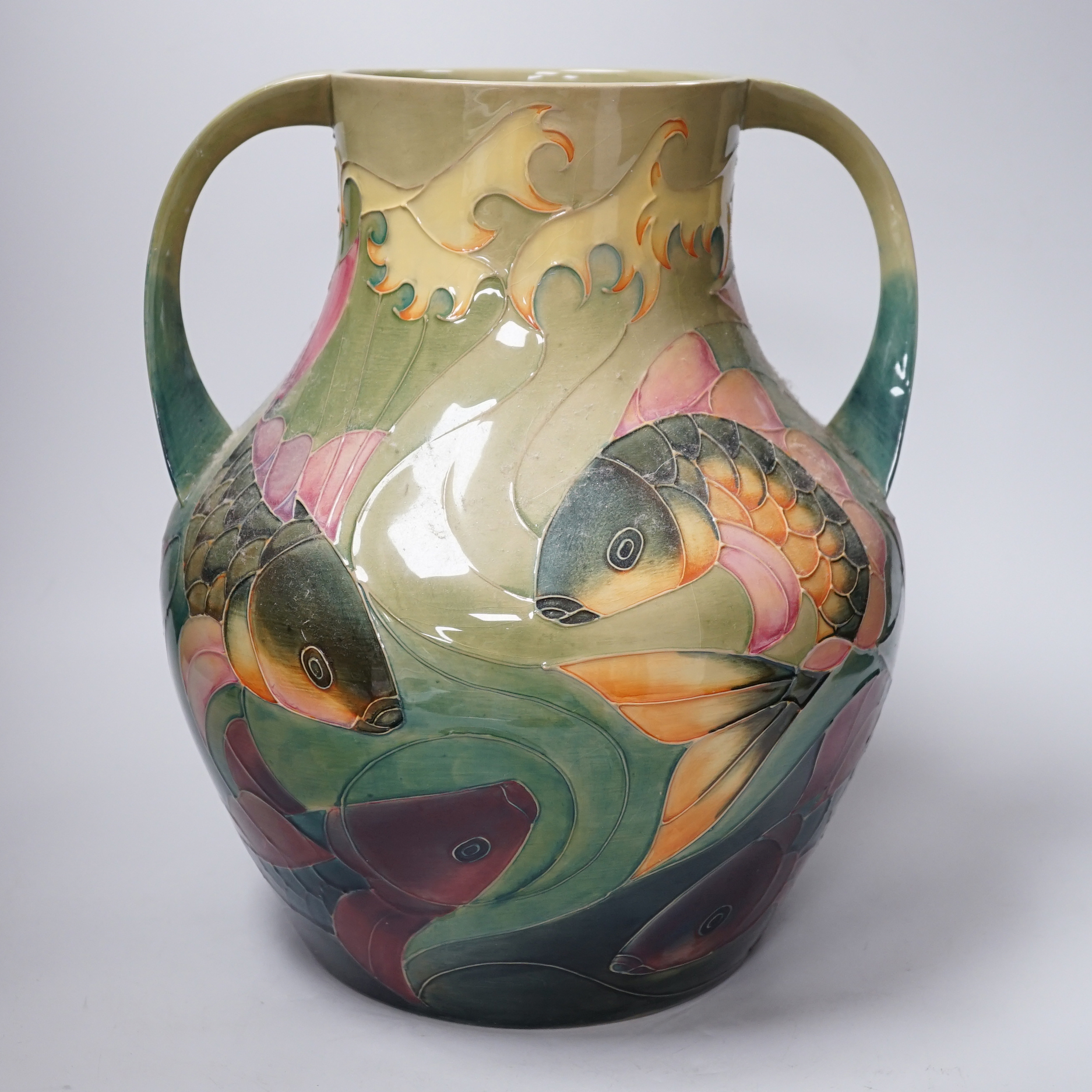 Large Moorcroft ‘Carp’ vase with twin handles designed by Sally Tuffin decorated with carp, 33cm high